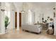 Bright living room with decorative pillars, light wood floors, and neutral-toned furniture, creating a spacious and inviting atmosphere at 2 Leone Ln, Hanahan, SC 29410