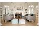 Bright living room featuring hardwood floors, fireplace and archway entrances at 2 Leone Ln, Hanahan, SC 29410