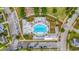 Overhead shot of community pool with seating, palm trees, and manicured landscaping in a residential setting at 202 Morning Song St, Summerville, SC 29485