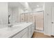 Bright bathroom featuring double sink vanity and glass shower enclosure, creating a modern and functional space at 202 Morning Song St, Summerville, SC 29485