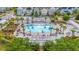 Community pool surrounded by palm trees and lounge chairs, creating a resort-like atmosphere at 202 Morning Song St, Summerville, SC 29485