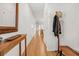 Hallway featuring wood floors, console table with decor, and coat rack for a welcoming entry at 202 Morning Song St, Summerville, SC 29485