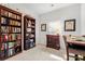 Functional home office with built-in bookshelves, desk space, and natural light, creating a productive workspace at 202 Morning Song St, Summerville, SC 29485