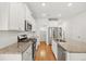 Modern kitchen with granite countertops, a center island, and stainless steel appliances at 202 Morning Song St, Summerville, SC 29485