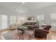 Cozy living room with an area rug, comfortable seating, and large windows for natural light at 202 Morning Song St, Summerville, SC 29485