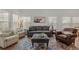 Bright living room featuring ample seating and natural light at 202 Morning Song St, Summerville, SC 29485