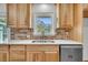 Charming kitchen featuring butcher block countertops, wooden cabinets, and a brick backsplash at 217 Mini Farm Rd, Bonneau, SC 29431