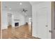 Bright living room with fireplace, wood floors, and modern fixtures at 217 Mini Farm Rd, Bonneau, SC 29431