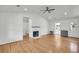 Bright living room with hardwood floors, shiplap walls, and a modern fireplace at 217 Mini Farm Rd, Bonneau, SC 29431