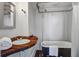 Unique bathroom with a clawfoot tub, wood countertop vanity, and vintage-inspired fixtures at 22 Ashton St, Charleston, SC 29403