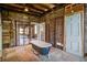 Unfinished bathroom featuring an antique clawfoot tub and exposed framework ready for customization at 22 Ashton St, Charleston, SC 29403