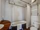 Bathroom featuring a clawfoot tub, industrial shower fixtures, and a wooden countertop vanity at 22 Ashton St, Charleston, SC 29403