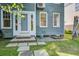 Charming home exterior with blue siding, a landscaped yard, and a welcoming front entrance at 22 Ashton St, Charleston, SC 29403