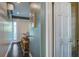 Hallway showcasing a bar and stools along the kitchen with natural light at 22 Ashton St, Charleston, SC 29403