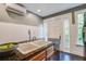 Charming kitchen featuring wooden cabinets, granite countertops, stainless steel appliances, and a double sink at 22 Ashton St, Charleston, SC 29403
