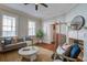 Bright living area with a decorative fireplace, hardwood floors, and comfortable seating arrangement at 22 Ashton St, Charleston, SC 29403