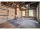 Renovated living room with original wood floors, exposed brick fireplace and bright windows at 22 Ashton St, Charleston, SC 29403