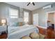 Serene bedroom featuring hardwood floors, bright windows, and a comfortable bed for a peaceful retreat at 22 Ashton St, Charleston, SC 29403
