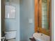 Efficient half bath with a modern floating sink and cabinet at 22 Ashton St, Charleston, SC 29403