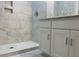 Elegant bathroom with marble-tiled shower and vanity at 222 New Iris Ln, Ridgeville, SC 29472