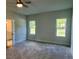 Comfortable bedroom with carpet flooring and natural light from two windows at 222 New Iris Ln, Ridgeville, SC 29472