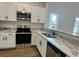 Stylish kitchen featuring stainless steel appliances and modern cabinetry at 222 New Iris Ln, Ridgeville, SC 29472