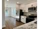 Kitchen with stainless steel appliances and granite countertops, and an adjacent dining area at 222 New Iris Ln, Ridgeville, SC 29472