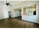 Bright living room featuring hardwood floors and a ceiling fan at 222 New Iris Ln, Ridgeville, SC 29472