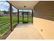 Spacious screened-in porch offers views of the fenced-in backyard at 222 New Iris Ln, Ridgeville, SC 29472