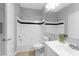 Bright bathroom featuring shower and tub, updated vanity, and modern design at 2221 Chatelain Way, Mount Pleasant, SC 29464
