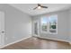 Well-lit bedroom showcasing wood-look floors, a ceiling fan, and a sliding glass door for outdoor access at 2221 Chatelain Way, Mount Pleasant, SC 29464