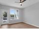 Bright bedroom featuring a ceiling fan, wood-look floors, and a sliding glass door for outside access at 2221 Chatelain Way, Mount Pleasant, SC 29464