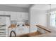 Modern kitchen with butcher block counters, white cabinetry, and stainless steel sink at 2221 Chatelain Way, Mount Pleasant, SC 29464