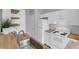 Well-lit kitchen featuring white cabinets, butcher block countertops, and stainless steel sink at 2221 Chatelain Way, Mount Pleasant, SC 29464
