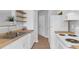 Well-lit kitchen with stainless steel sink, wood countertops, and white appliances at 2221 Chatelain Way, Mount Pleasant, SC 29464