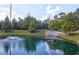 Scenic pond view featuring a fountain surrounded by lush greenery and walking paths at 2221 Chatelain Way, Mount Pleasant, SC 29464