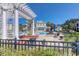 Inviting pool area with an elegant pergola, poolside seating, and well-maintained landscaping for a relaxing atmosphere at 2221 Chatelain Way, Mount Pleasant, SC 29464