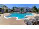 Stunning community pool with a central island, surrounded by lounge chairs, offering a perfect spot for relaxation at 2221 Chatelain Way, Mount Pleasant, SC 29464