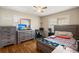 Comfortable bedroom with wooden furniture, hardwood floors, and a bright sunny window at 223 Dandridge Rd, Walterboro, SC 29488