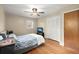 Relaxing bedroom with ceiling fan, wood floors, and ample closet space at 223 Dandridge Rd, Walterboro, SC 29488