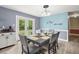 Cozy dining area with laminate flooring, table setting, and access to the backyard at 223 Dandridge Rd, Walterboro, SC 29488