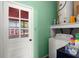 Functional laundry room with a washing machine and ample storage at 223 Dandridge Rd, Walterboro, SC 29488