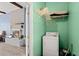 Connected laundry room adjacent to a cozy living area with a fireplace at 223 Dandridge Rd, Walterboro, SC 29488