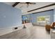 Spacious living room with hardwood floors and brick accents, filled with natural light at 223 Dandridge Rd, Walterboro, SC 29488