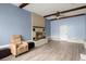Neutral room featuring a cozy chair and a brick fireplace with a ceiling fan at 223 Dandridge Rd, Walterboro, SC 29488
