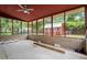 Spacious enclosed patio providing a view of a fenced backyard and storage shed at 223 Dandridge Rd, Walterboro, SC 29488