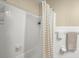 Bathroom shower showcasing a white shower curtain and coordinated towel racks at 223 Dandridge Rd, Walterboro, SC 29488
