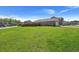 Backyard with a large lawn and wooden privacy fence at 223 Goshen Rd, Moncks Corner, SC 29461