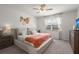 Bedroom featuring neutral colors, a ceiling fan, a window with curtains, and decorative wall art at 223 Goshen Rd, Moncks Corner, SC 29461