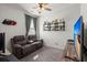 Bedroom featuring a ceiling fan, shelving with decor, and a comfy recliner sofa at 223 Goshen Rd, Moncks Corner, SC 29461